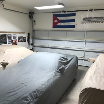 Garage with Covered Cars, Wall Art, Flags, and Lighting - Mike