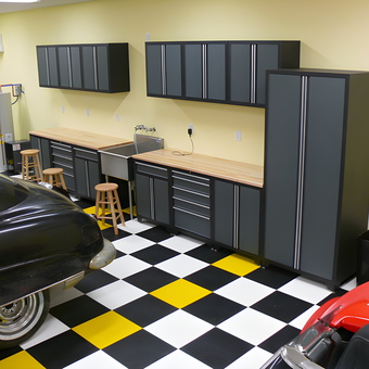 Modern garage with cabinets, workbenches, and checkered floor - Wyn from Mishawaka, IN