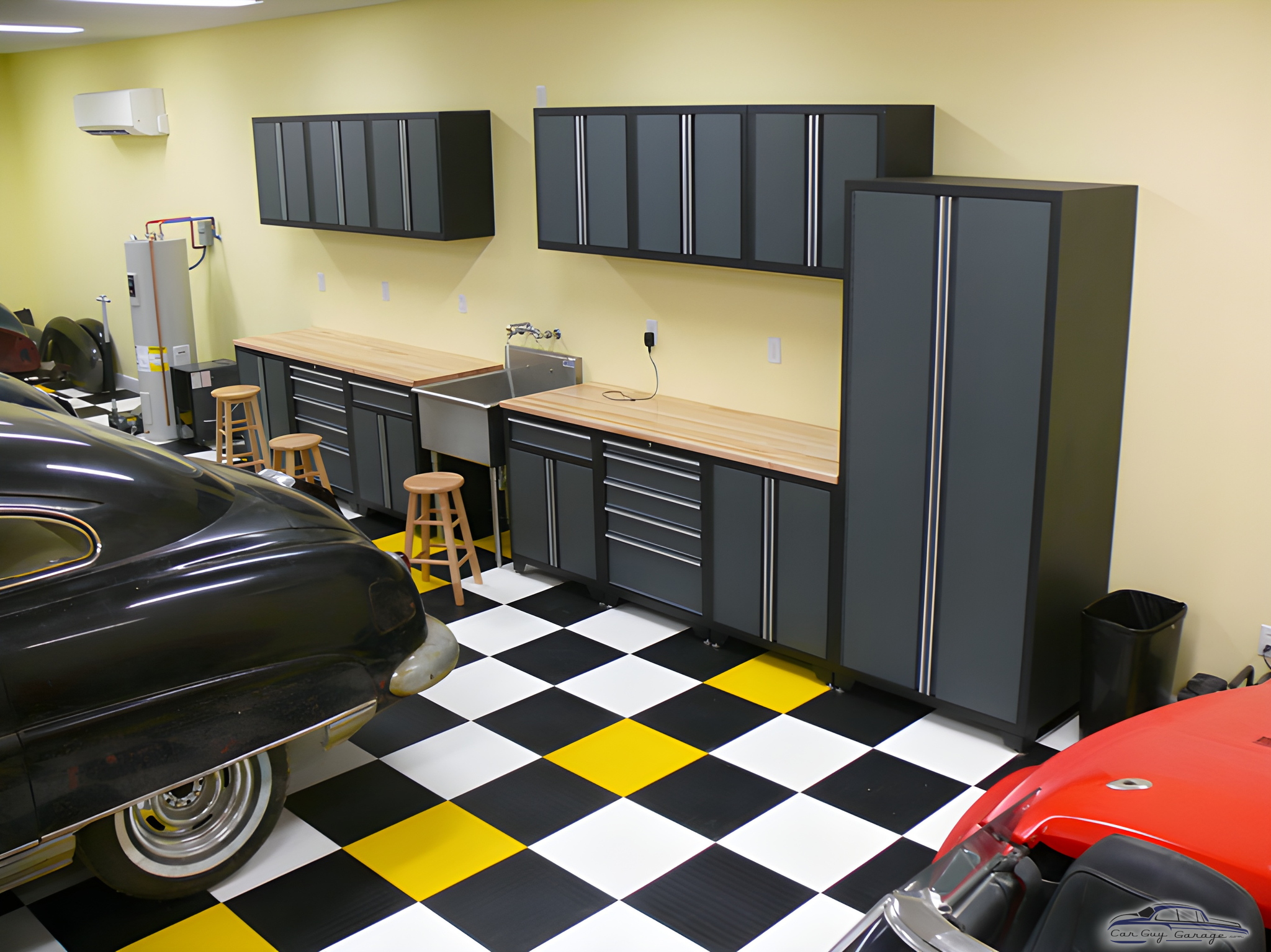 Modern garage with cabinets, workbenches, and checkered floor - Wyn from Mishawaka, IN