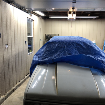 Organized garage with covered vehicle and ladder - TNT from Feasterville-Trevose, Pa