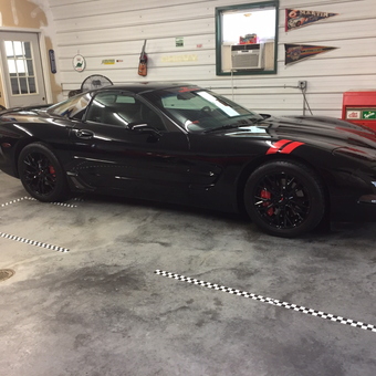 Organized garage with Corvette, wall art, and tool chest - Landspeedracer from Tallapoosa, Ga.
