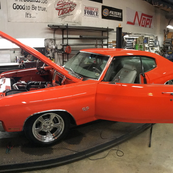 Classic Red Muscle Car on Lift in Organized Garage - Hyde Von Hitchcock from Owings, Md