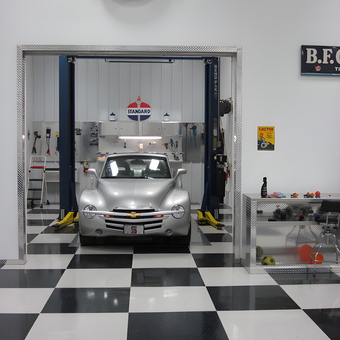Classic Car Garage with Lift and Neon Signs - R & L Farms from Garden City, KS