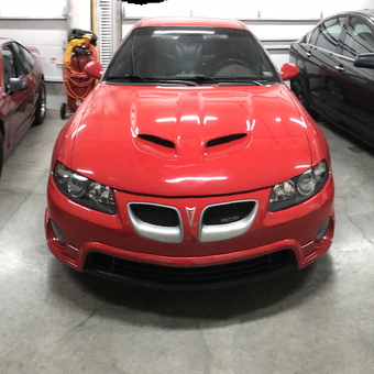Clean garage with three cars and organized storage - CuJo from Peculiar, MO