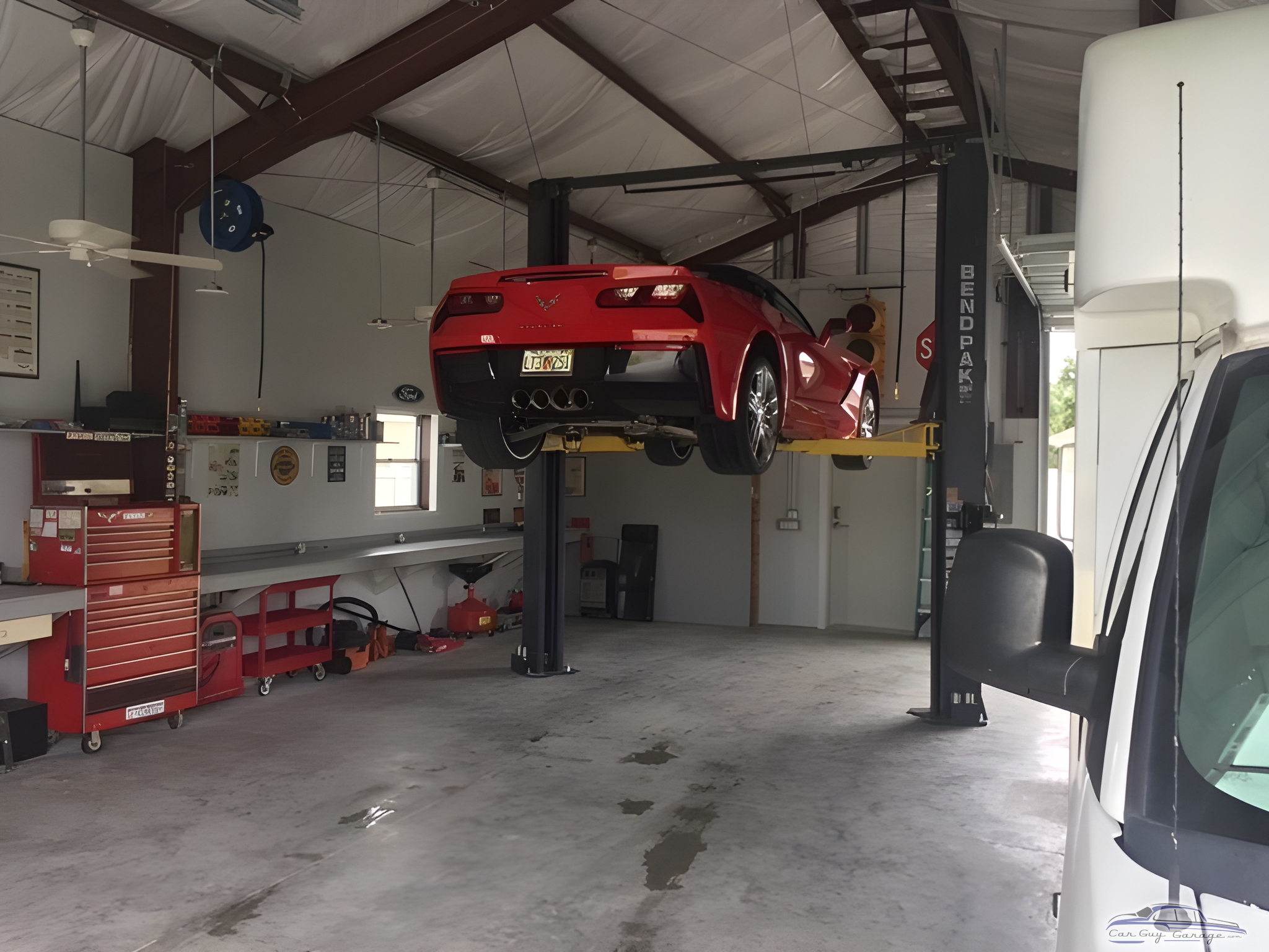 Organized garage with car lift and tool chests - Dave's Garage from Port Charlotte, FL