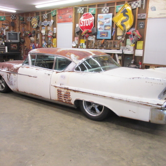 Classic car and vintage signs in organized garage - Rick from Monroe, NC