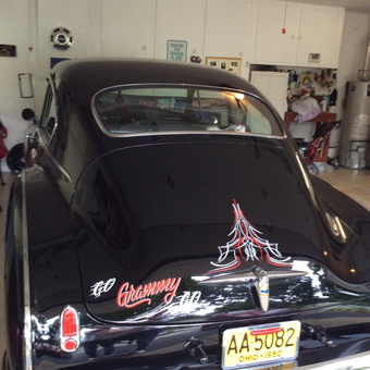 Classic black car with custom pinstriping in garage - Grammy from Painesville, Ohio