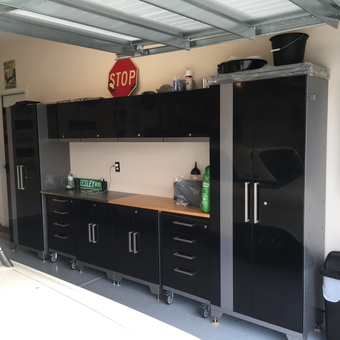Sleek Black Garage Cabinets With Wood Countertop - Patnewkey from Denver, North Carolina