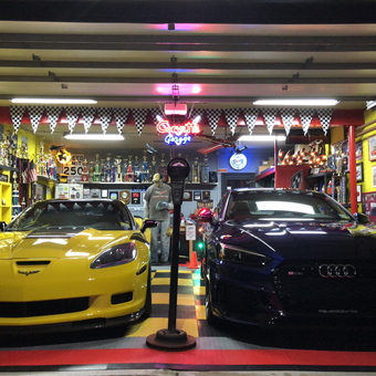 Colorful Garage with Corvette and Audi Display - Loujitsu