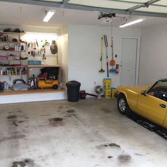 Organized garage with shelving, tools, and yellow classic car - Jimboga from Gainesville, GA