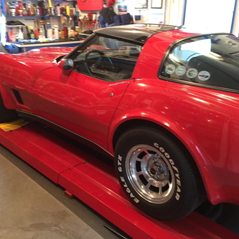 Red Classic Car on Garage Lift with Tools - Dick from Norwich, NY