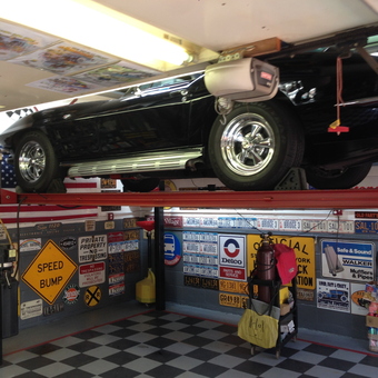 Classic Car Lift and Vintage Signs in Custom Garage - Sallyboy's Garage from Staten Island, N.Y