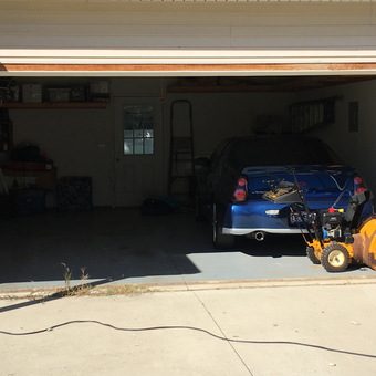 Organized garage with blue car, shelves, and tools - The_Maniac from Mentor on the Lake, OH