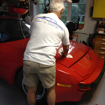 Man Detailing Red Sports Car in Organized Garage - Vince from West Hempstead, NY