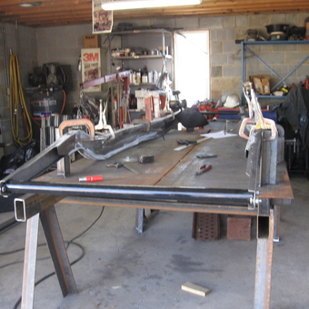 Welding Table with Clamps and Tools in Organized Garage - Tommy from LYMAN, SC