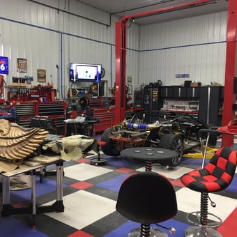 Organized garage with tool chests, car lift, and decor - James from Newcastle, Wyoming