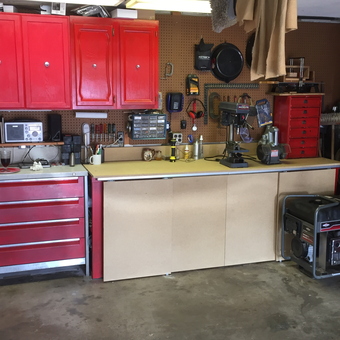 Organized garage with red cabinets and tool chest - John from Pittsburgh, PA