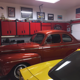 Classic Car Garage with Red Cabinets and Wall Decor - Joe S. from North Richland Hills, Texas