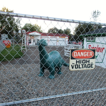 Garage with Vintage Gas Signs and Dinosaur Statue - Michael Neville from Golden, COLORADO