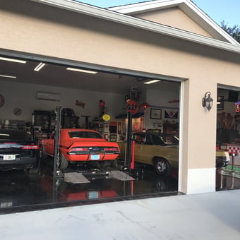 Classic car garage with lifts and vintage signs - Life's love from Punta Gorda, Florida