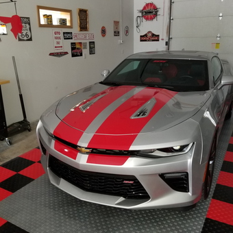 Silver Camaro in themed garage with wall signs - Silver 455hp from Post Falls, ID