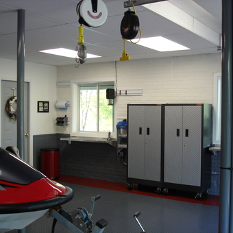 Organized garage with diamond plate cabinets and jet ski - Dennis from Bluffton, SC