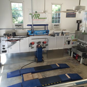 Organized garage with car lift, pegboard, and work sink - Craig H from Charlotte, NC