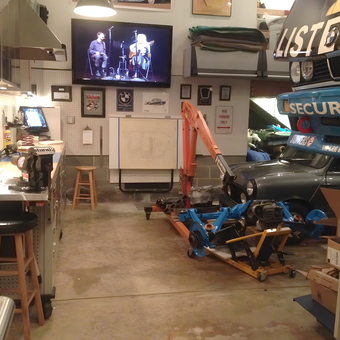 Organized garage with workbench, tool storage, and race cars - Craig H from Charlotte, NC