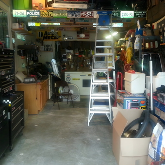 Organized garage with tool chests, ladders, and storage - Thug Hunter from MO