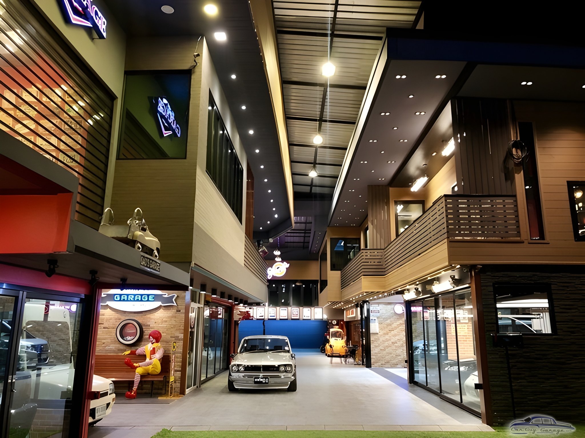 Modern garage with classic cars and neon signs - Heng from Bangkok