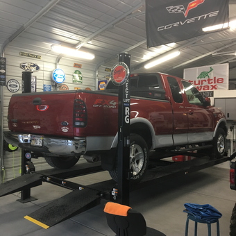 Truck on Four Post Lift with Garage Signs - RG from Pahrump, NV
