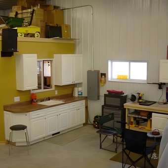 Organized garage with cabinets, workbench, and tool storage - Greg from Johnston, IA
