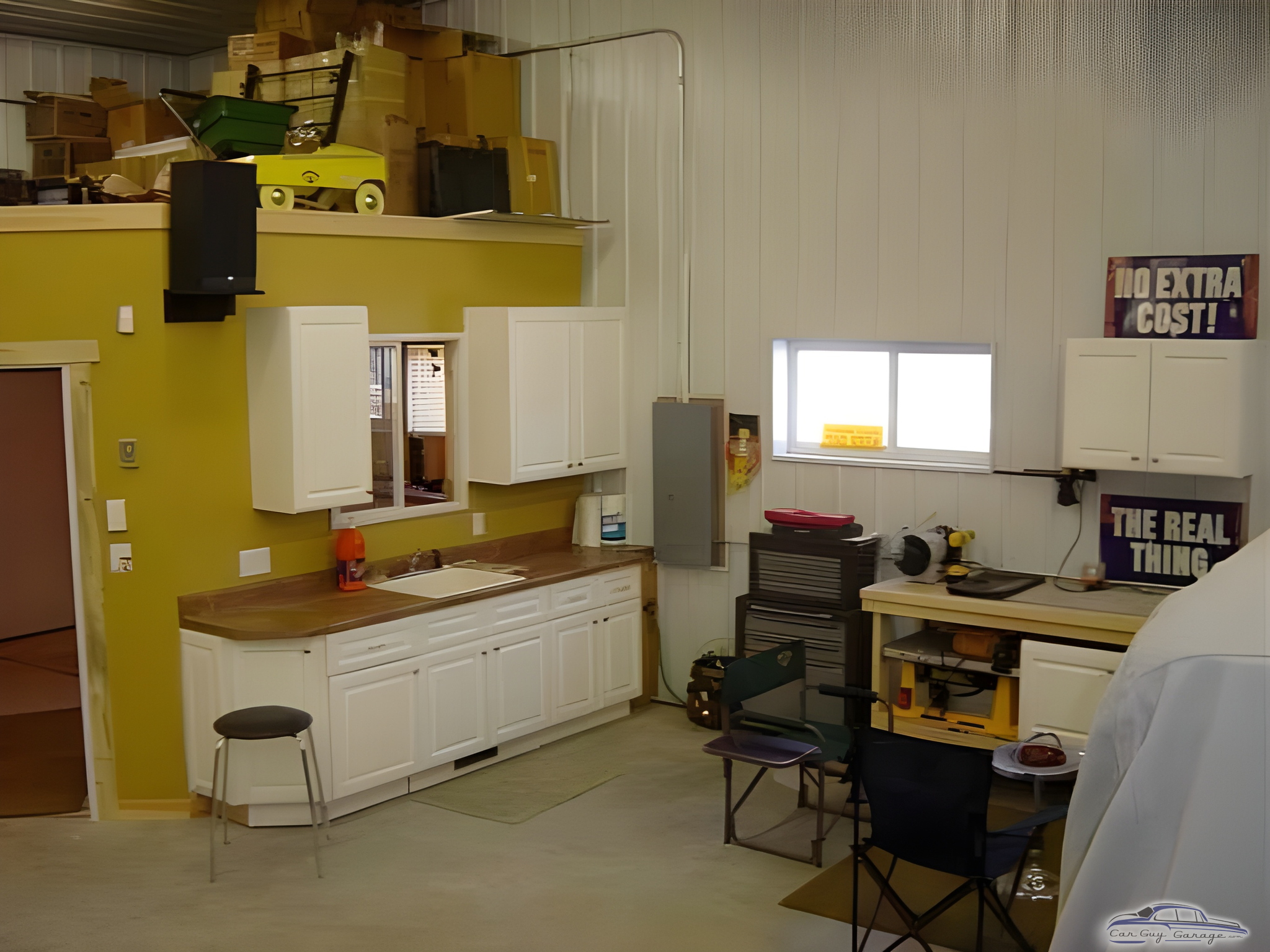 Organized garage with cabinets, workbench, and tool storage - Greg from Johnston, IA