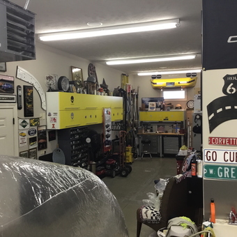 Organized garage with yellow cabinets and car decor - Patrick from Tuscola, IL