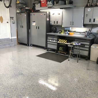 Organized garage with cabinets, workbench, and epoxy floor - Jayman from Ponte Vedra Beach, FL