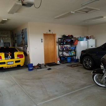 Organized garage with cars, motorcycle, and storage shelves - Jeff from Queen Creek, AZ