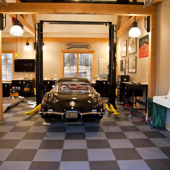 Classic Car on Lift in Well-Equipped Garage - Car Lifts