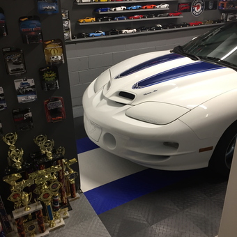 Garage With Diecast Car Display, Trophies, and Race Flooring - Ralph from Somers, NY