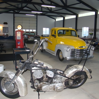Classic Garage with Yellow Chevy Pickup and Vintage Motorcycle - Skull from WELLINGTON, NV