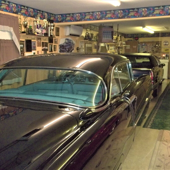 Classic Car Garage with Trophies and Wall Decor - caddyman