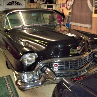 Classic Cadillac in Well-Organized Garage with Wall Decor - caddyman