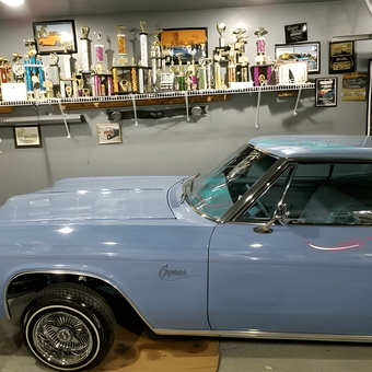 Classic Lowrider and Trophy Display in Garage - 1stLady Super Natural Lowriders from LOS ANGELES, CA