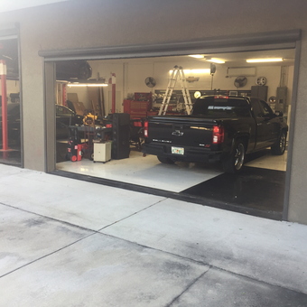 Organized Garage with Car Lift and Tool Storage - Bossman from TAMPA, FL