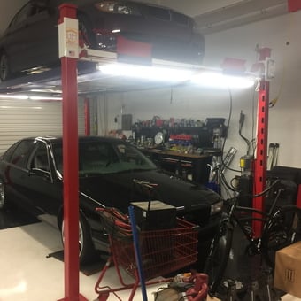 Two Post Car Lift with Workbench and Tools - Bossman from TAMPA, FL