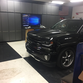 Modern garage with storage cabinets and truck - Bossman from TAMPA, FL