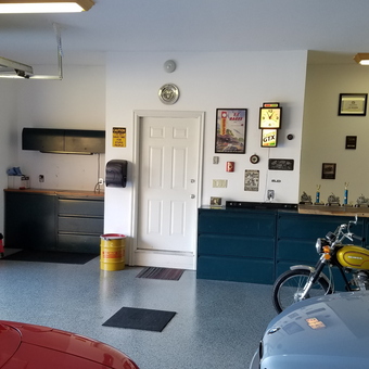 Organized garage with tool cabinets, trophies, and classic bikes - Rick from Temple, PA