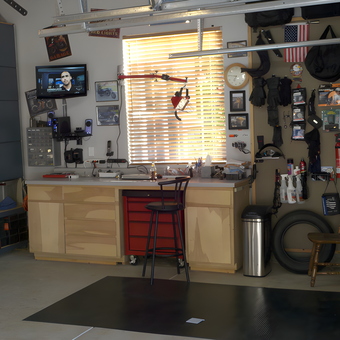 Organized garage workspace with cabinets and wall storage - Warren from El Dorado Hills, CA