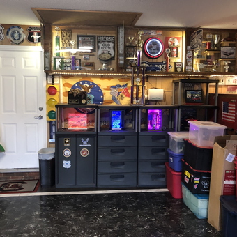 Organized garage with wall signs, storage bins, and trophies - James from Sumter, SC