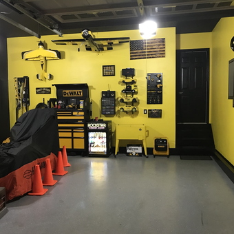 Organized yellow garage with tool storage and pegboards - Doug from Ashburn, VA