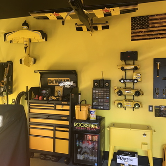 Yellow garage with DeWalt tool chest and wall-mounted tools - Doug from Ashburn, VA